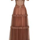 Elegant navy Marilyn maxi dress by JOSÉPHINE displayed on a hanger with flowing fabric and detailed neckline.