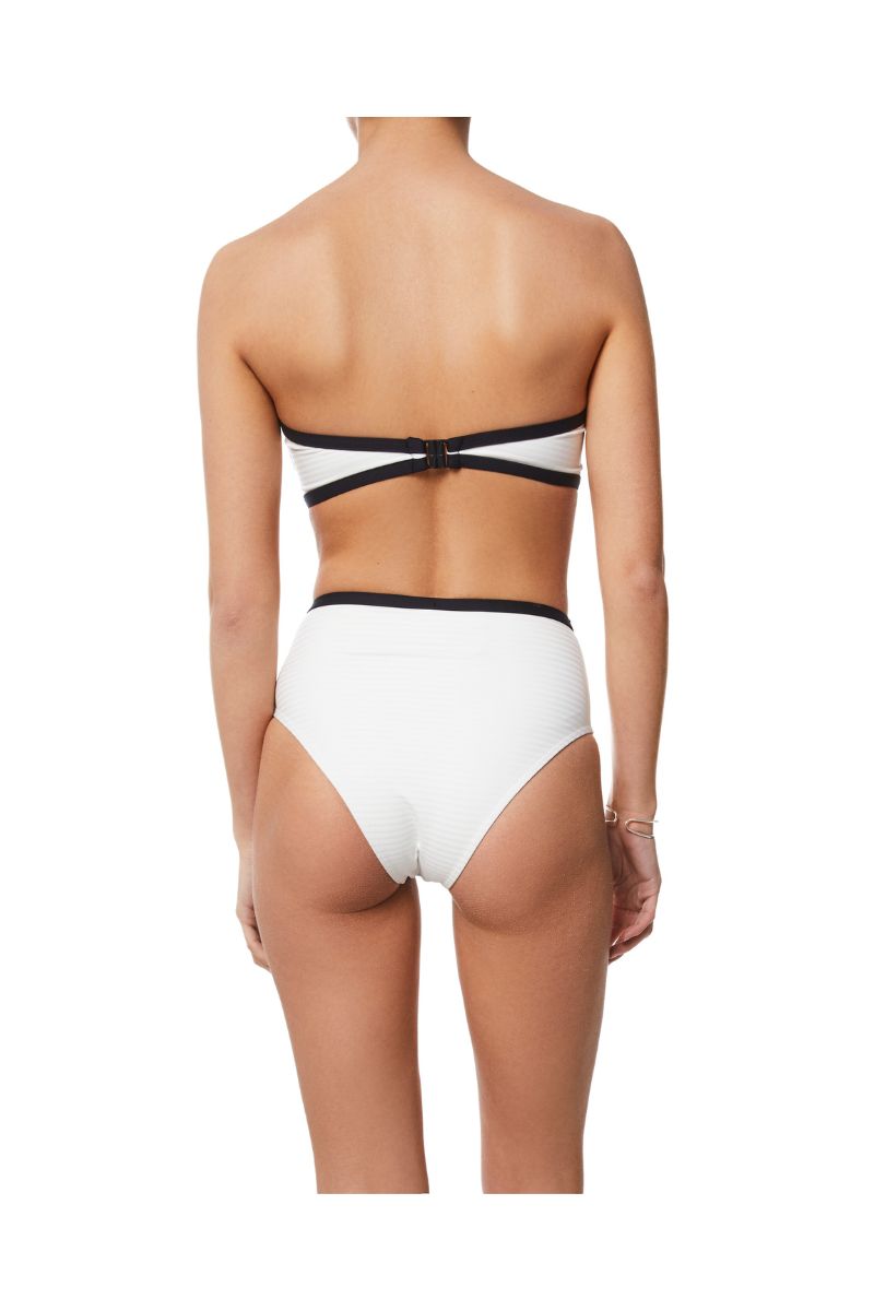 White bikini set featuring June embossed top and Cora embossed bottom by KIÓHNE, with textured fabric details.