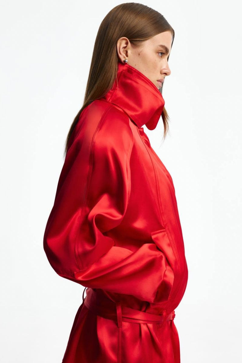 Red funnel neck jacket by Santa Brands, featuring a stylish design with a high collar and comfortable fit.