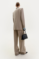 Taupe wool tailored jacket by ELENAREVA, showing a classic fit with structured lapels and sleek design on a mannequin