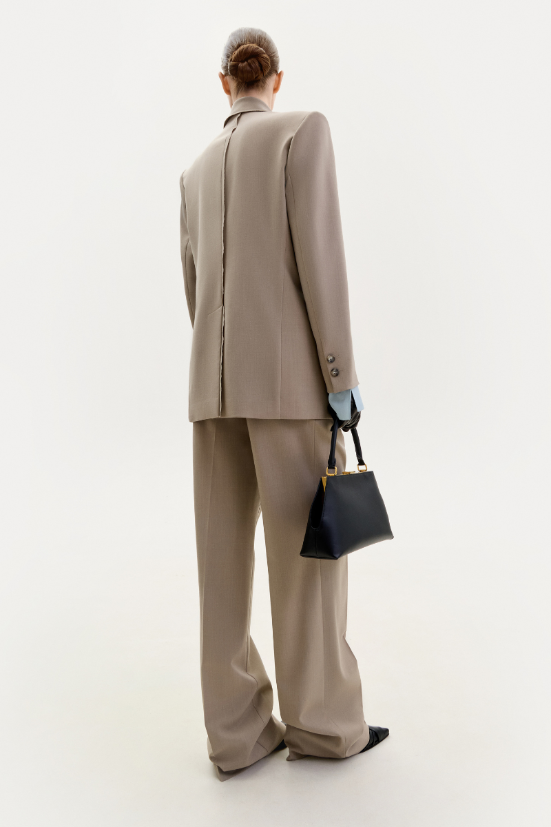 Elenareva taupe straight-leg trousers displayed on a model, showcasing classic tailored pants with a sleek fit.