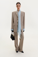 ELENAREVA taupe straight-leg trousers showing a sleek, tailored fit with a smooth waistband and classic straight-leg design.