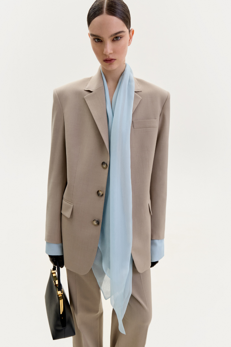 Elenareva taupe straight-leg trousers shown on a model, featuring a classic fit and tailored design for a sophisticated look.