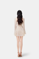 Beige Jaliyah mini dress by Montsand, featuring stylish jali cutout design, fitted silhouette, and sleeveless style.
