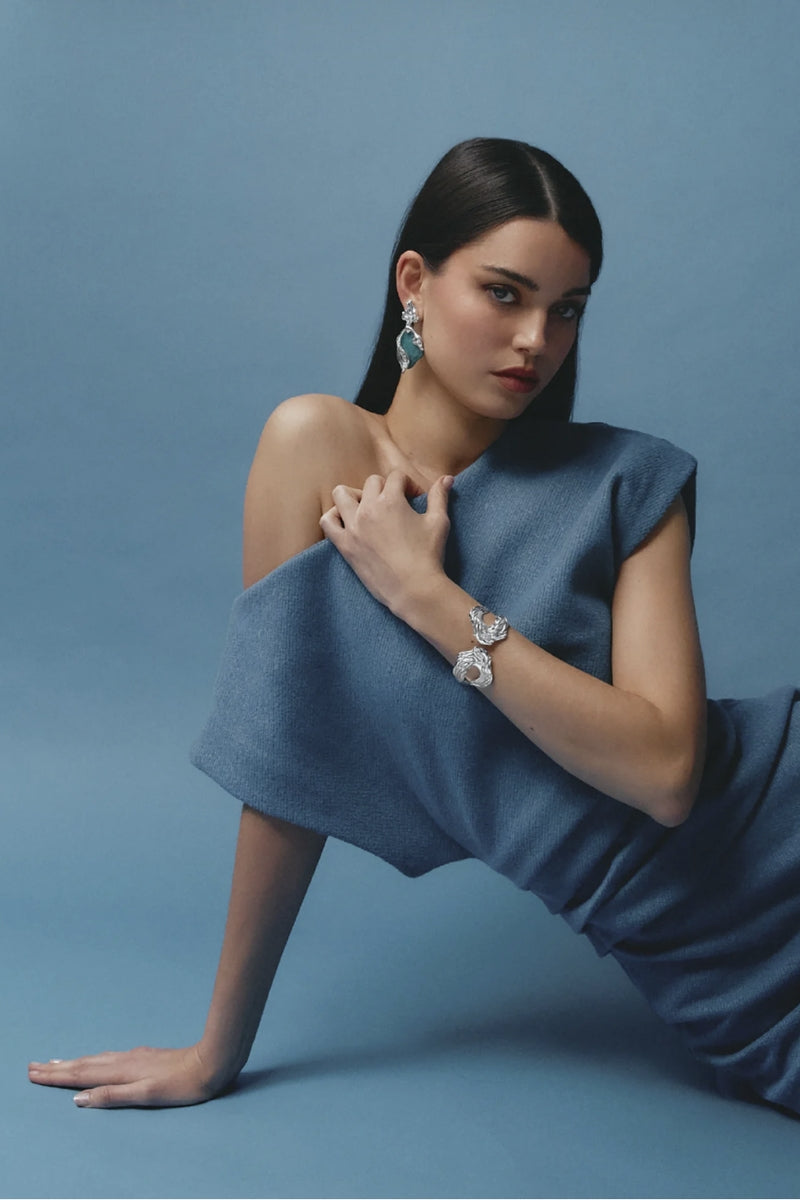 Shiny rhodium Janus cuff bracelet by Jude Benhalim featuring a sleek, modern design with smooth curves and polished finish.