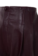 Japanese leather pants in wine red by MAZ Manuela Álvarez, featuring a sleek fit and smooth leather texture.