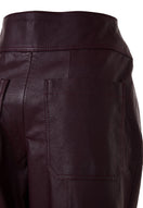 Japanese leather pants in wine red from MAZ Manuela Álvarez, showcasing sleek fit and smooth leather texture.