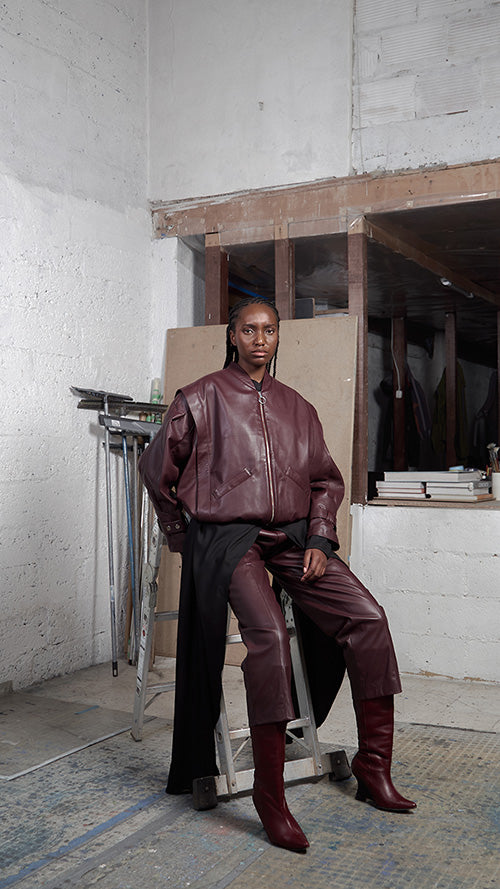 Japanese leather pants in wine red by MAZ Manuela Álvarez, featuring a sleek fit and smooth texture.