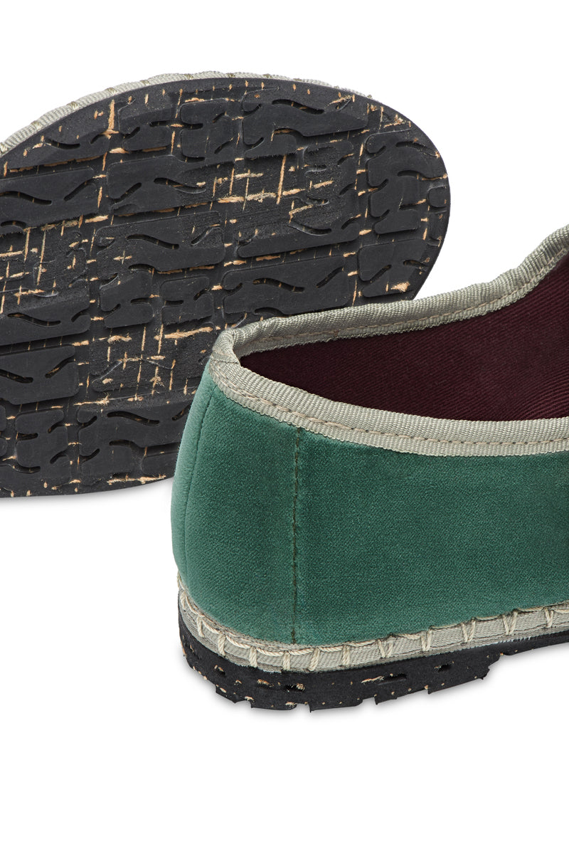 Flabelus Jay green flats with light green piping, stylish slip-on footwear, shown from a side angle on a white background.