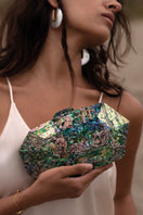 Green Jaya Paua clutch by Freya Rose featuring intricate shell detailing for elegant evening accessories.