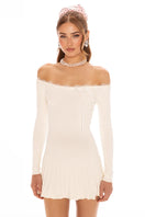White Jenna dress by Nana Jacqueline, a stylish mini dress with a fitted silhouette and elegant design, shown on a model.