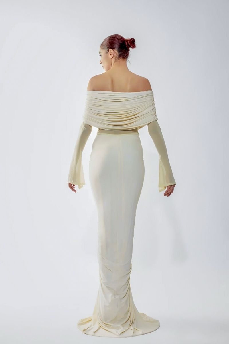 Deme By Gabriella Jolene off-shoulder ruched gown in elegant fabric, featuring a fitted bodice and flowing skirt.