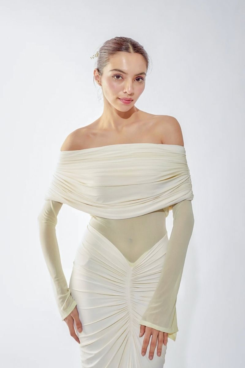 Deme By Gabriella Jolene off-shoulder ruched gown in elegant fabric, featuring a flowing silhouette and fitted bodice.