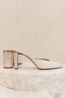 Ivory leather block heel shoes with pearl embellishments by Freya Rose, showcasing elegant design and stylish craftsmanship.