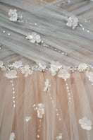 Elegant JOSÉPHINE MARTHA gown with flowing fabric and detailed design, perfect for formal occasions and evening events.
