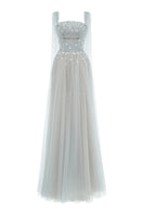 Elegant Joséphine Martha dress gown with flowing fabric and intricate details, perfect for formal occasions.