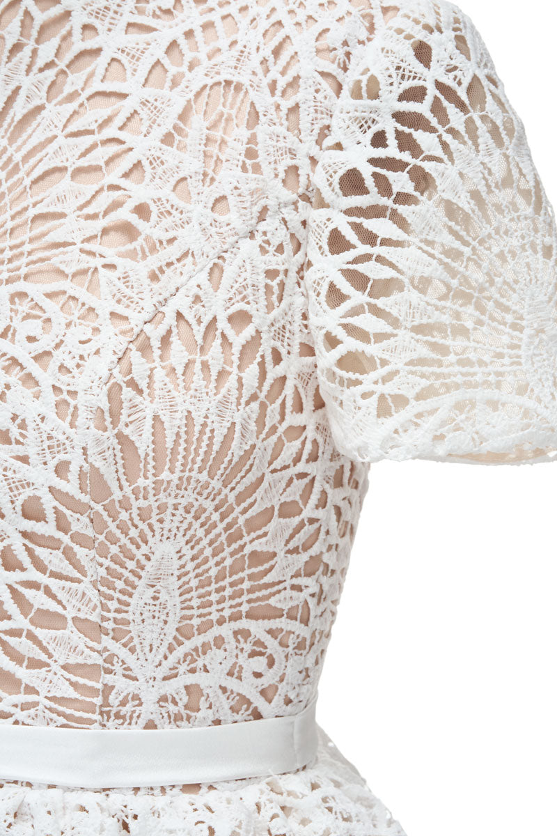 White Rella gown by JOSÉPHINE, elegant dress with flowing fabric and refined design, perfect for formal occasions.