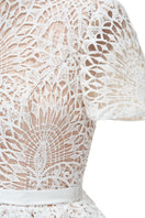 White Rella gown by JOSÉPHINE, elegant dress with flowing fabric and refined design, perfect for formal occasions.