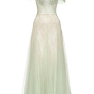Green TINLEY gown by JOSÉPHINE, featuring elegant fabric and a flowing silhouette, displayed on a dress form.