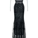 Black CIARA gown by JOSÉPHINE, featuring elegant fabric and a flowing silhouette, perfect for formal occasions.