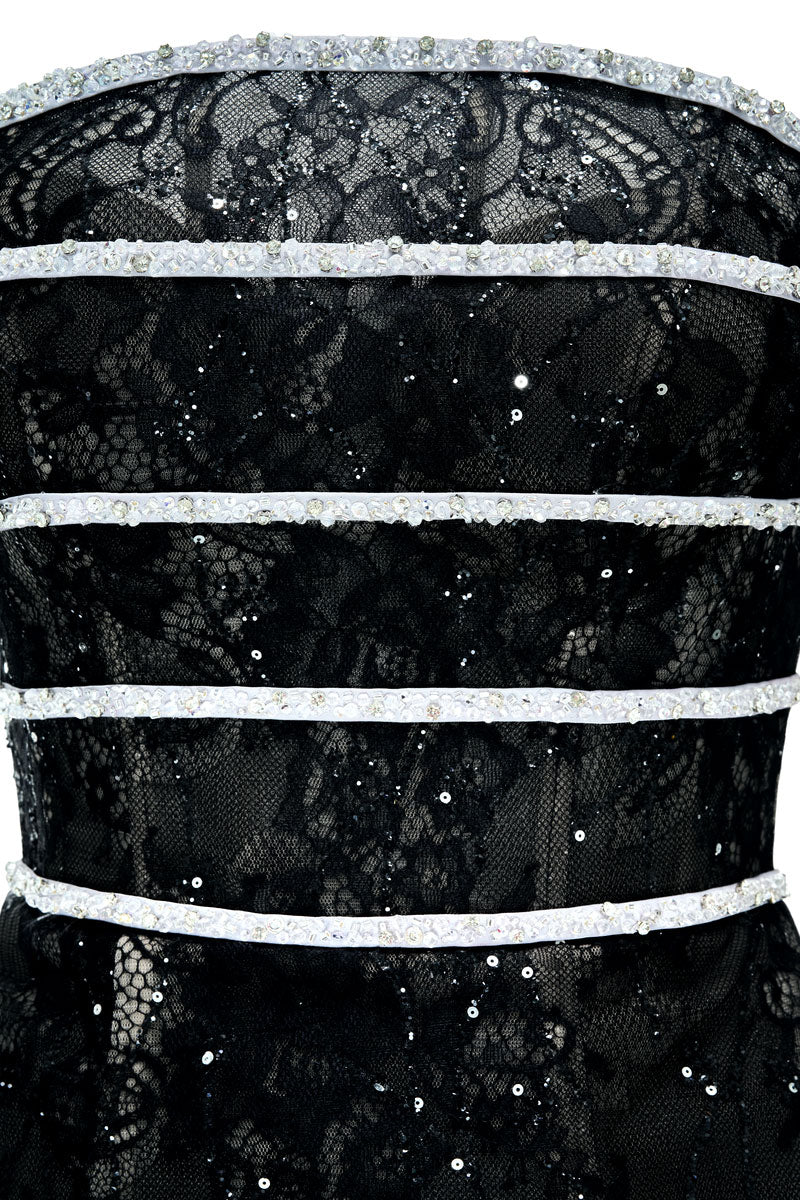 Black CIARA gown by JOSÉPHINE, elegant evening dress with flowing fabric and sophisticated design, shown in the image.