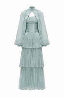 Blue ALZIRA gown by JOSÉPHINE, elegant dress with flowing fabric and detailed design, perfect for formal occasions.