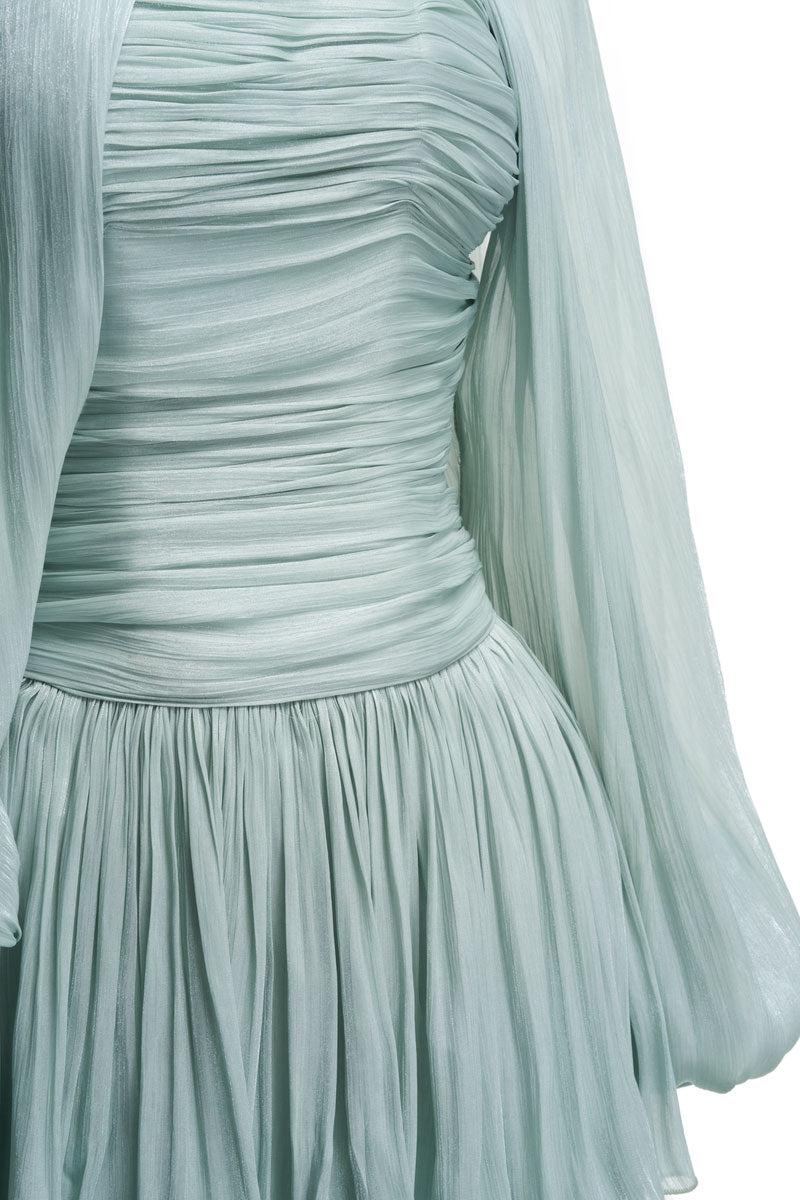 Blue ALZIRA midi dress by JOSÉPHINE, featuring a flowing fabric and elegant design, displayed on a hanger.