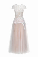 White Angelica gown by Joséphine, elegant long dress with flowing fabric and delicate design perfect for formal occasions.