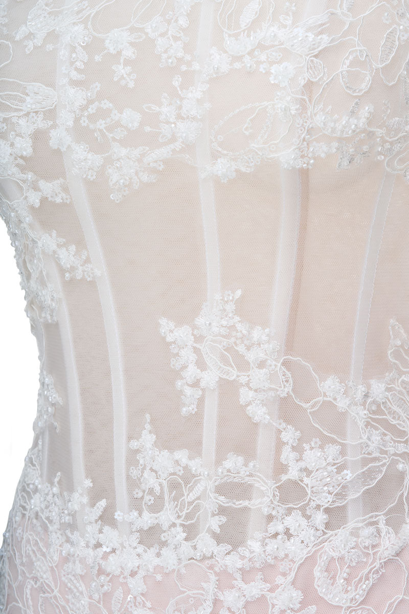 White Angelica maxi dress by JOSÉPHINE featuring flowing fabric and elegant design, perfect for summer or formal occasions.
