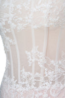 White Angelica gown by Joséphine featuring elegant fabric and flowing design, perfect for special occasions.