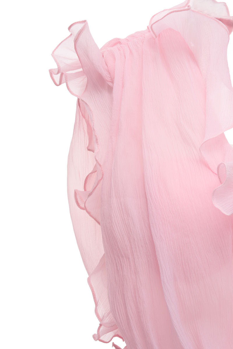 Pink Valencia maxi dress by JOSÉPHINE, flowing fabric and elegant design, shown on a model in a sunny outdoor setting.