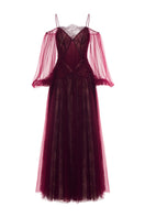Elegant burgundy Rosalie gown by Joséphine, featuring flowing fabric and intricate design details on a model.