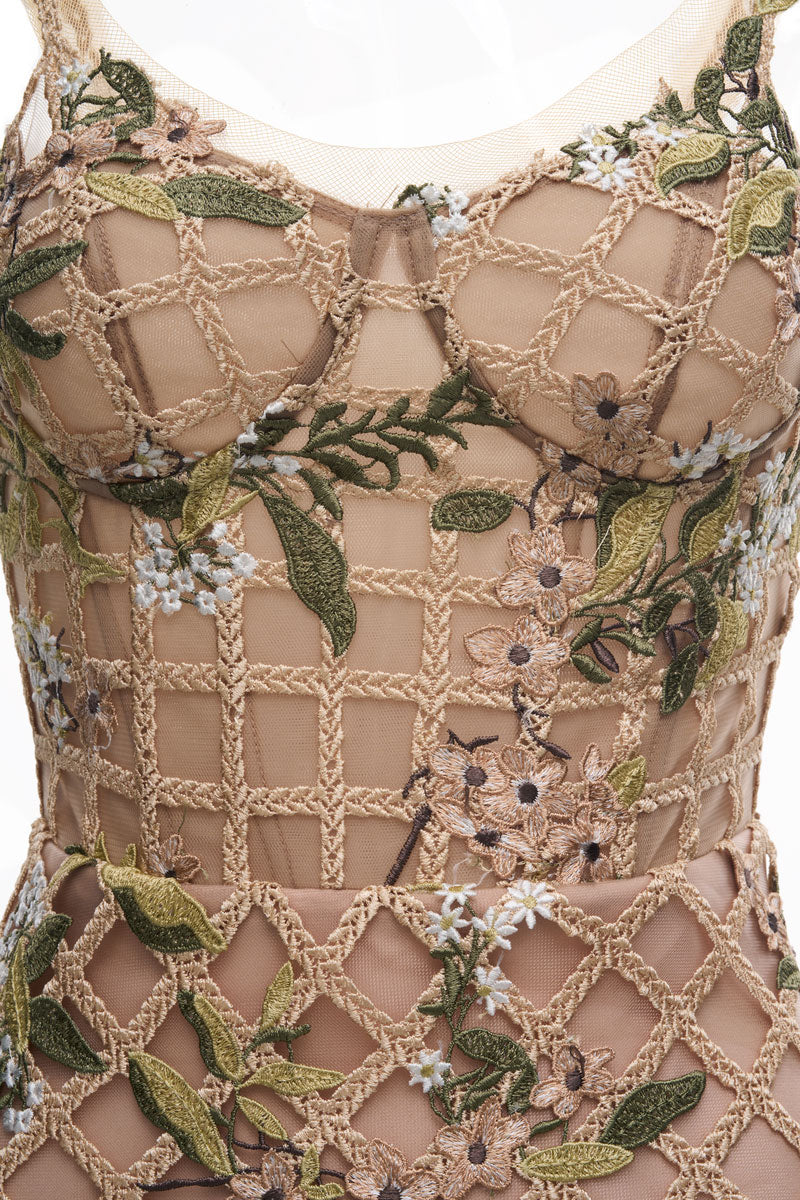 Beige Elsie midi dress by JOSÉPHINE displayed on a model, showcasing its elegant design and flowing fabric.