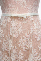White YURI gown by JOSÉPHINE featuring elegant fabric and flowing design, perfect for formal occasions.