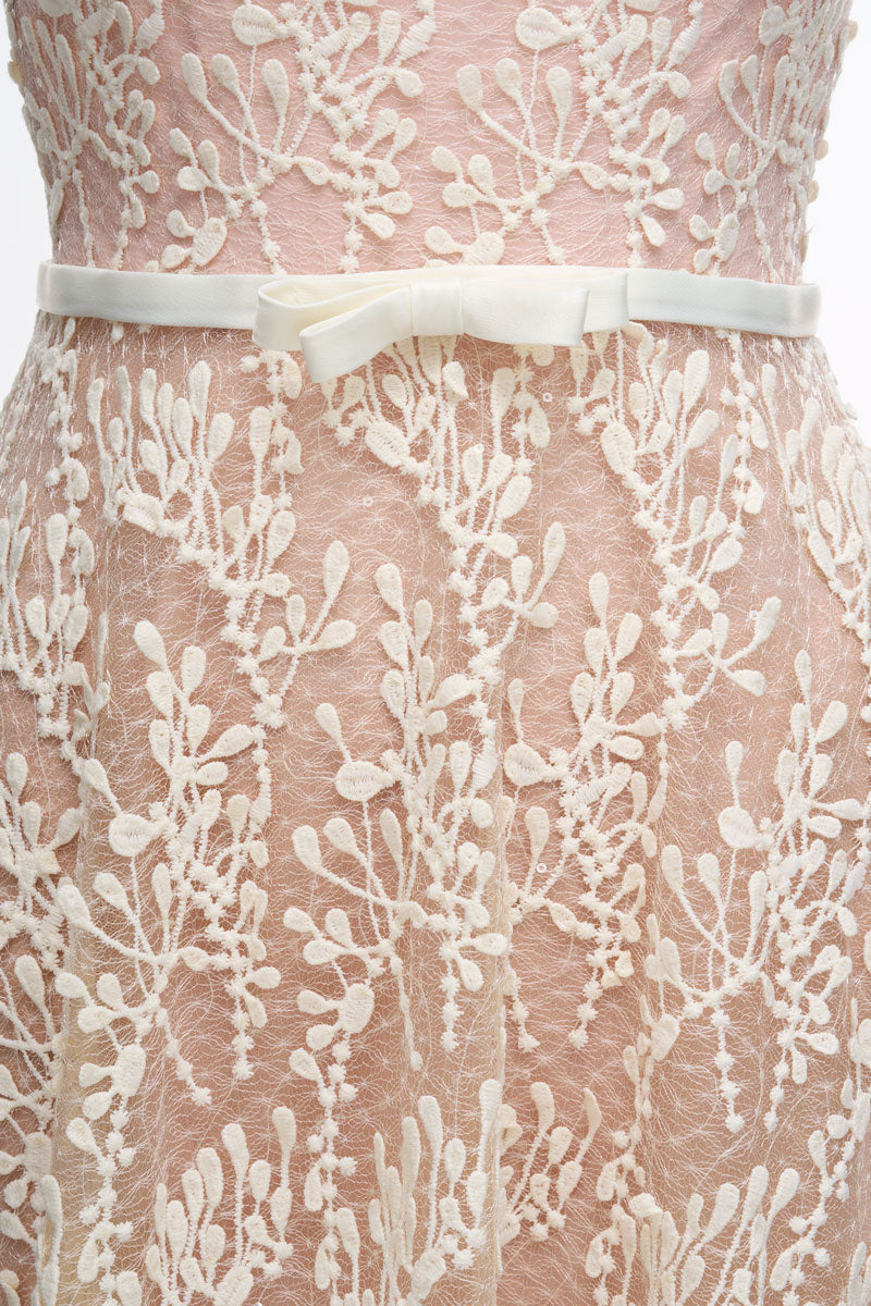 Elegant JOSÉPHINE RIKA lace midi dress displayed on a model, featuring intricate lace details and a stylish, feminine silhouette.