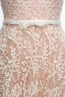 Elegant white lace gown by JOSÉPHINE, featuring intricate lace details and a flowing silhouette, perfect for formal occasions.