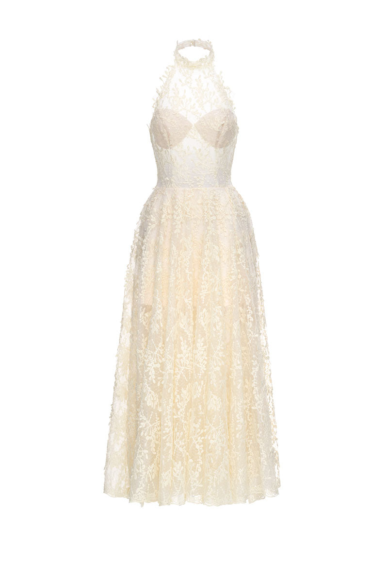 Cream Cynthia midi dress by JOSÉPHINE, flowing fabric with elegant design, shown on a model in a stylish setting.
