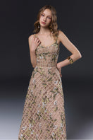 Beige Elsie gown by Joséphine, elegant long dress with flowing fabric and subtle details, perfect for formal occasions.