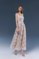 Elegant white YURI gown by JOSÉPHINE, flowing fabric and detailed design, perfect for formal occasions.