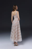 Elegant white YURI gown by JOSÉPHINE, flowing fabric with delicate design, perfect for formal occasions.