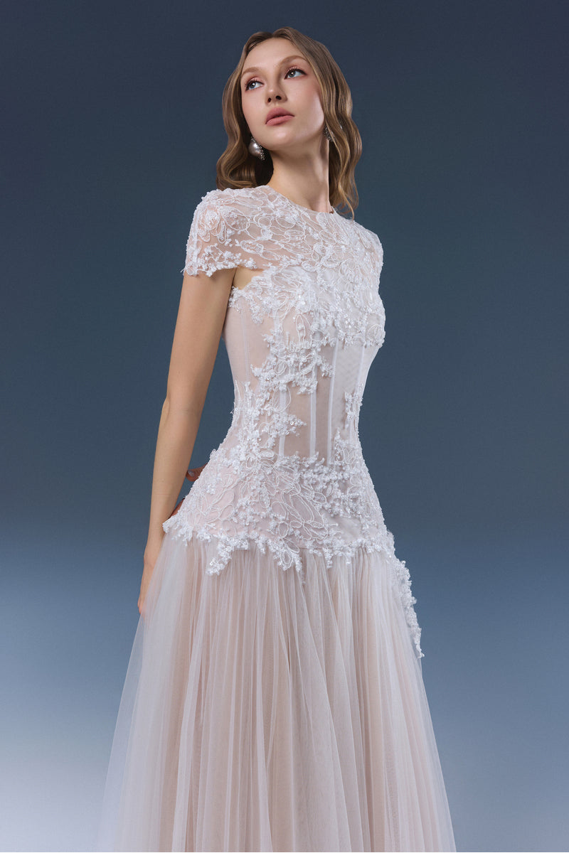 White Angelica maxi dress by JOSÉPHINE, flowing fabric, sleeveless design, elegant style, displayed on a hanger.