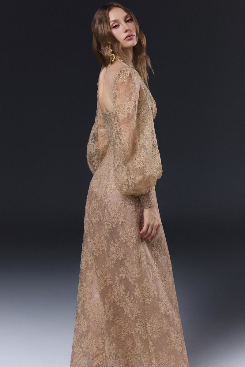 Beige JADOLINE maxi dress by JOSÉPHINE displayed on a hanger, showcasing its flowing fabric and elegant design.