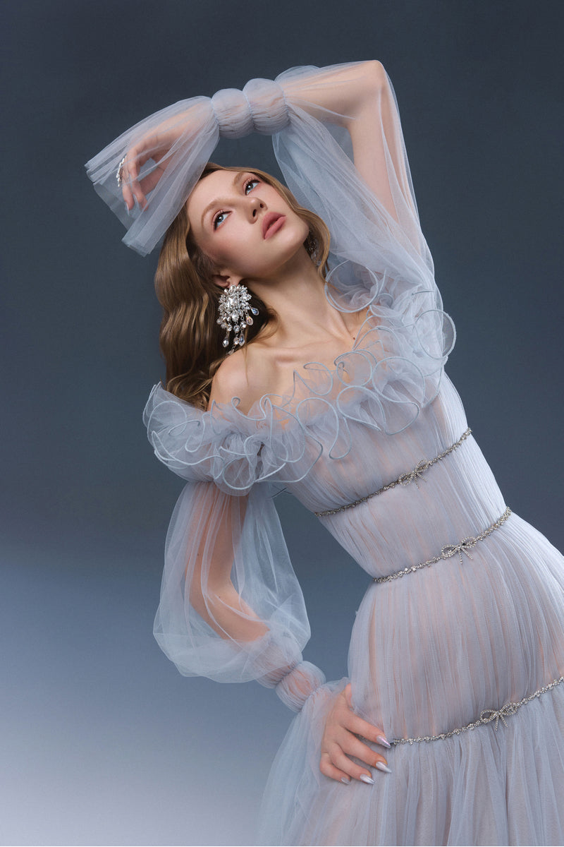 Blue AURORA maxi dress by JOSÉPHINE, flowing fabric with a stylish design, perfect for elegant summer occasions.