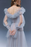 Blue Aurora gown by Joséphine, elegant evening dress with flowing fabric and intricate design details.