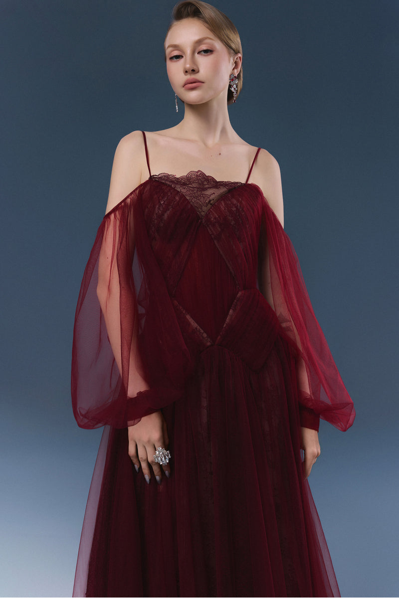 Elegant burgundy maxi dress by JOSÉPHINE with flowing fabric and fitted bodice, perfect for formal occasions.
