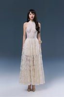 Cream Cynthia gown by Joséphine, flowing fabric and elegant design, shown on a model.