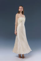 Elegant lace gown by JOSÉPHINE featuring intricate lace details and a flowing silhouette.