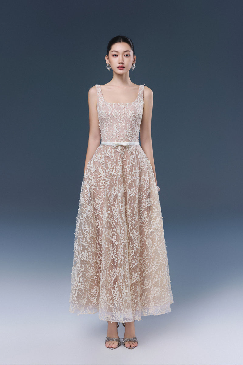 JOSÉPHINE RIKA lace midi dress displayed on a hanger, featuring intricate lace fabric and a flowing silhouette.