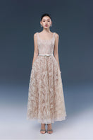 Elegant lace gown by JOSÉPHINE featuring intricate lace details and a flowing silhouette, perfect for formal occasions.