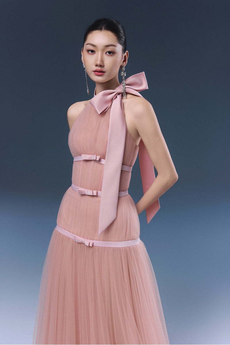 Pink BLISS maxi dress by JOSÉPHINE, flowing fabric and elegant design, shown on a model with a close-up of the dress details.